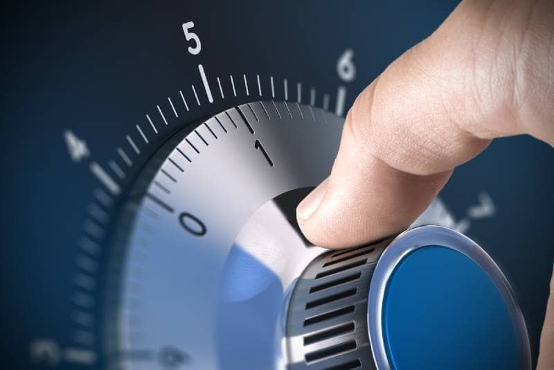 Safe & Vault Locksmith Service in Richmond Hill by Locksmith On Demand – A close-up of a hand turning the dial of a secure safe, representing professional safe and vault installation, unlocking, and repair services in Richmond Hill.