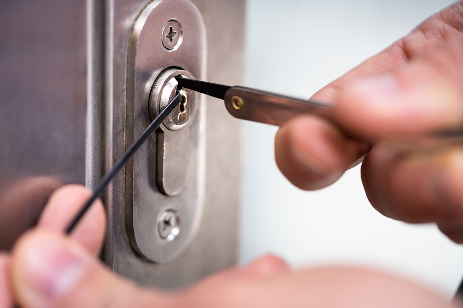 Locksmith Man Fixing Door Lock. Lockpicker Technician