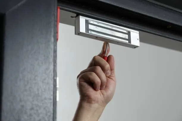 Imgi 5 Man With Screwdriver Installing Electromagnetic Door Lock Indoors Closeup Home Security